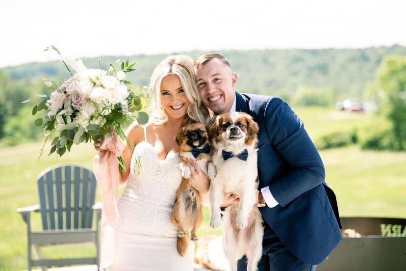 Sarah and her husband, Matthew, with Finn and Harley. (Courtesy of <a href="https://www.instagram.com/finn.the.griffy.mix/">Sarah Geers</a>)