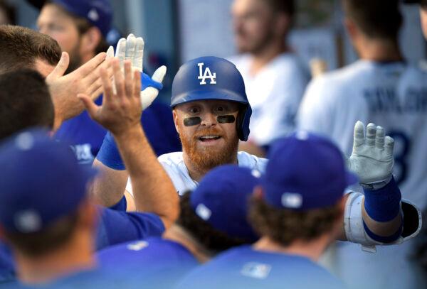 Justin Turner #10 of the Los Angeles Dodgers celebrates after hitting a solo home run against starting pitcher Joe Musgrove #44 of the San Diego Padres during the second inning at Dodger Stadium in Los Angeles on June 30, 2022. (Kevork Djansezian/Getty Images)