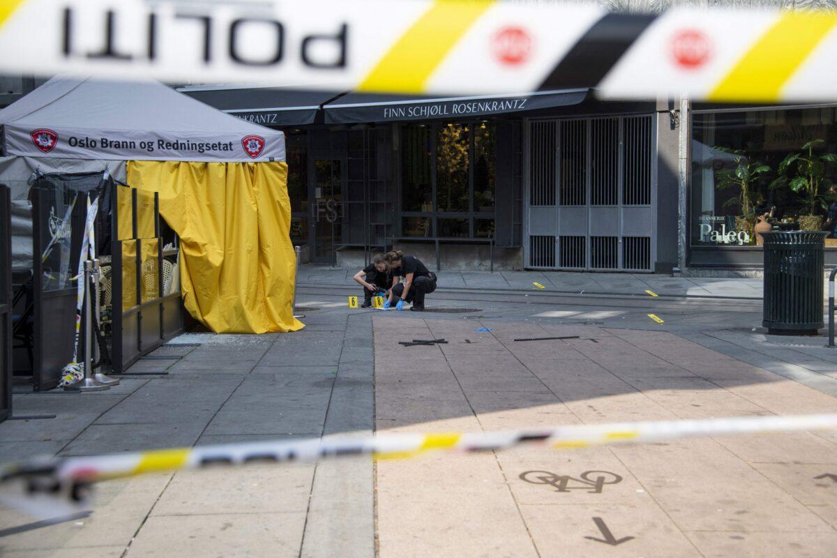 Police investigators work at the crime scene in the aftermath of a shooting outside pubs and nightclubs in central Oslo, Norway, on June 25, 2022. (Olivier Morin/NTB/AFP via Getty Images)