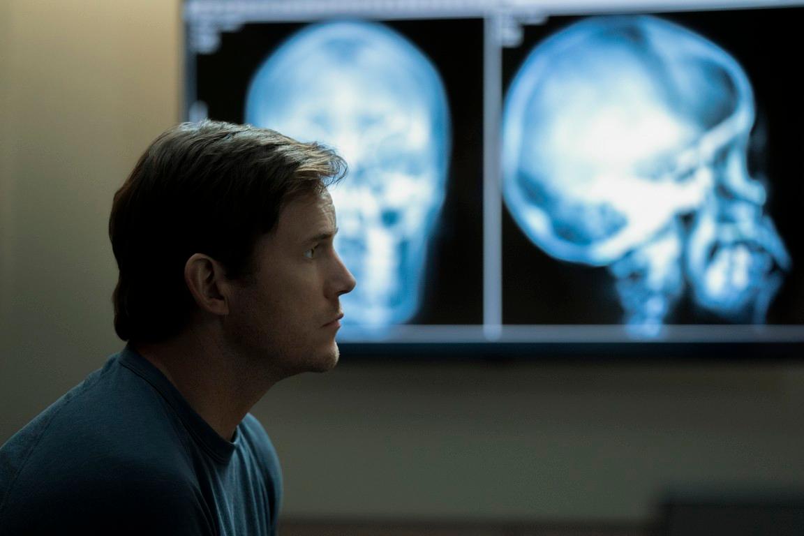 Lt. Cmdr. James Reece (Chris Pratt), trying to get an understanding of the debilitating headaches he's experiencing, in "The Terminal List." (Fuqua Films/Amazon Studios)