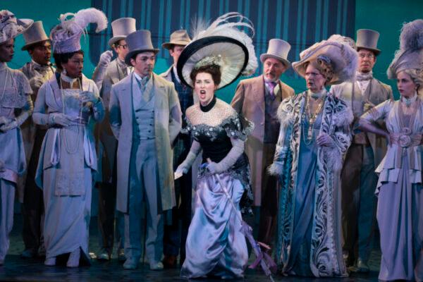 “At the Ascot”: Shereen Ahmed as Eliza Doolittle in forefront with some of the ensemble in “My Fair Lady.” (Joan Marcus)