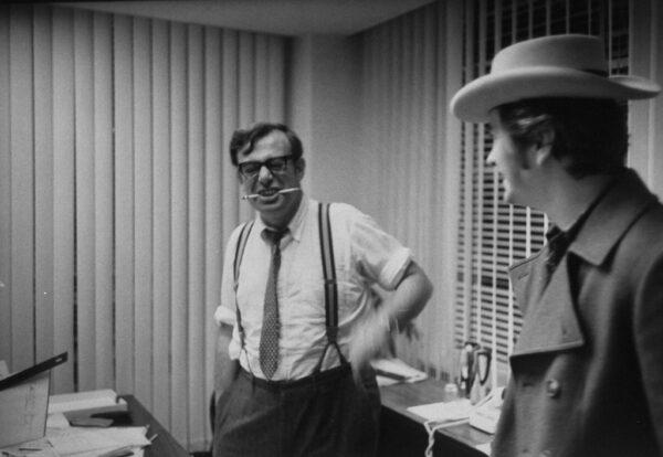 Donald Rugoff (L) in his office with Robert Downey in the 1960s from the documentary film “Searching for Mr. Rugoff.” (The Life Images Collection/Bob Peterson/Getty Images)