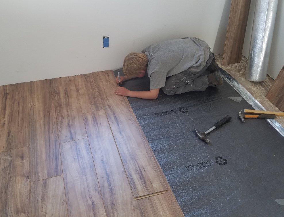 "Installing new flooring in my first house. I was 11 here ... this is how I homeschool," said Cole. (Courtesy of <a href="https://www.facebook.com/HomeschoolMBA">Tina Cooper</a>)