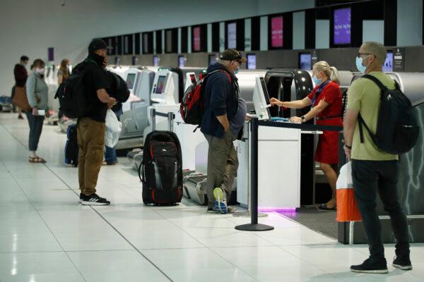 People check-in for flights at Melbourne Airport in Melbourne, Australia, on Nov. 23, 2020. (Daniel Pockett/Getty Images)