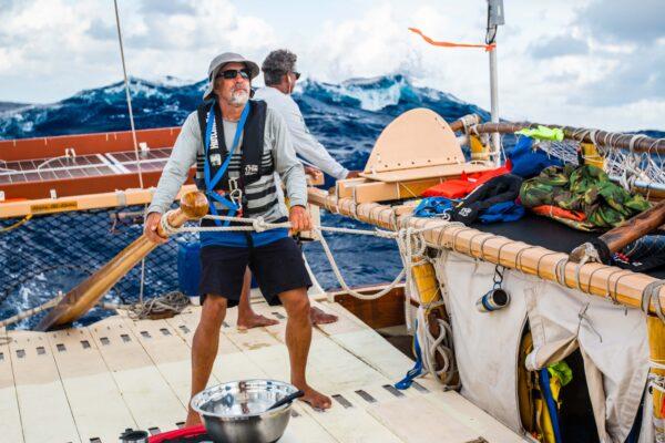 Manning the tiller is a key role aboard the Hokule‘a—especially on rough seas. (Courtesy of Polynesian Voyaging Society)