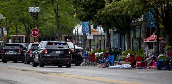 First responders work the scene of a shooting at a Fourth of July parade in Highland Park, Ill., on July 4, 2022. ( Jim Vondruska/Getty Images)