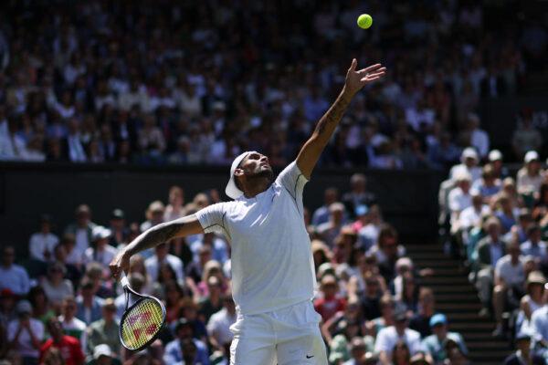 Nick Kyrgios of Australia serves against Brandon Nakashima of the United States of America during their Men's Singles Fourth Round match on day eight of The Championships Wimbledon 2022 in London, England, on July 4, 2022. (Clive Brunskill/Getty Images)