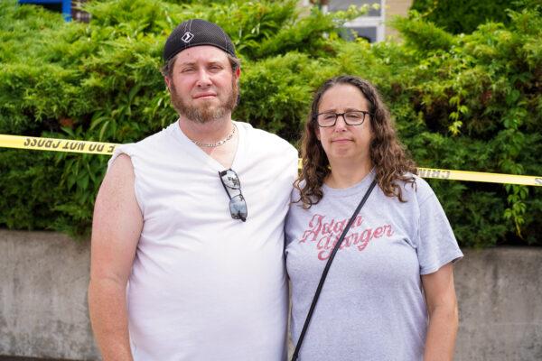 Jamie Draper (L) and Joanna Dolins stand in downtown Highland Park, Ill., on July 5, 2022. (Cara Ding/The Epoch Times)