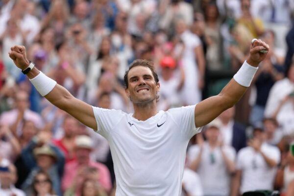 Spain's Rafael Nadal celebrates after beating Taylor Fritz of the US in a men's singles quarterfinal match on day ten of the Wimbledon tennis championships in London on July 6, 2022. (Kirsty Wigglesworth/AP Photo)