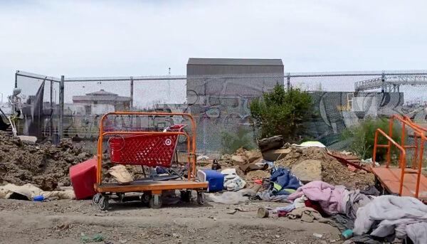 A Target shopping cart by the road near a homeless encampment in Oakland, Calif., on May 26, 2022. (Cynthia Cai/NTD Television)