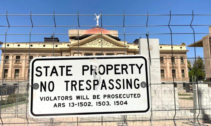 Fortress-Like Fence in Place Around Arizona’s Capitol Following Riot