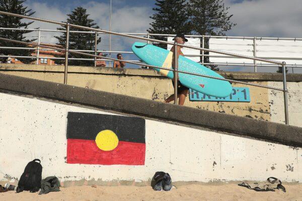 An Aboriginal flag is seen in Bondi Beach during Australia Day celebrations, in Sydney, Australia, on Jan. 26, 2022. (AAP Image/Jeremy Ng)
