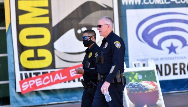 Police officers walk by the convention center during Comic-Con Special Edition in San Diego on Nov. 27, 2021. (Chris Delmas/AFP via Getty Images)