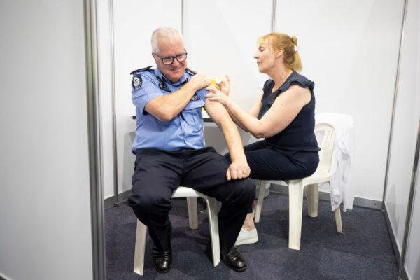 WA Police Commissioner Chris Dawson receives his COVID-19 vaccination at Perth Convention and Exhibition Centre, in Australia on March 7, 2021. (Simon Santi - Pool/Getty Images)