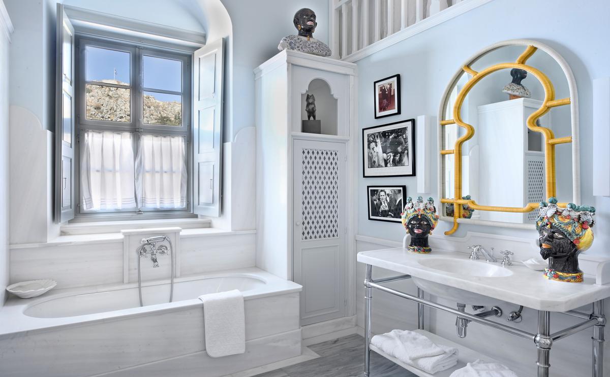 Each of the property’s bedrooms and baths reflect an impressive attention to finery and detail as is exhibited throughout the property. Here, the tasteful use of marble and stone are highlighted by fine interior design elements. (Courtesy of Greece Sotheby's International Realty)