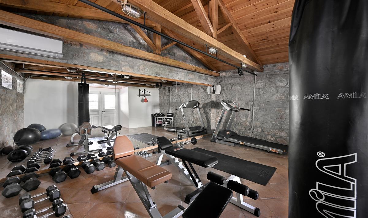 Serious fitness enthusiasts and athletes will enjoy time spent in the well-equipped gym. (Courtesy of Greece Sotheby's International Realty)