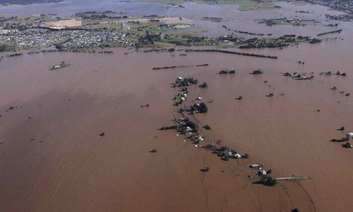 Flood Survivors Stress About Insurance and Future Risks