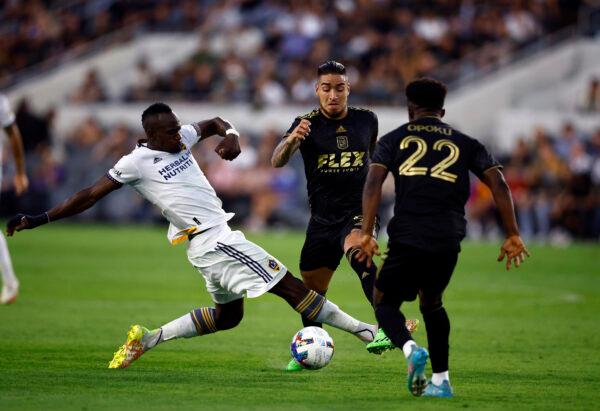 Séga Coulibaly #4 of Los Angeles Galaxy controls the ball against Cristian Arango #9 of Los Angeles FC in the first half at Banc of California Stadium, in Los Angeles, on July 08, 2022. (Ronald Martinez/Getty Images)