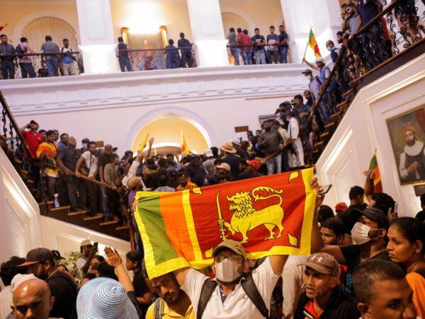 Demonstrators protest inside the President's House, after President Gotabaya Rajapaksa fled, amid the country's economic crisis, in Colombo, Sri Lanka, on July 9, 2022. (Dinuka Liyanawatte/Reuters)