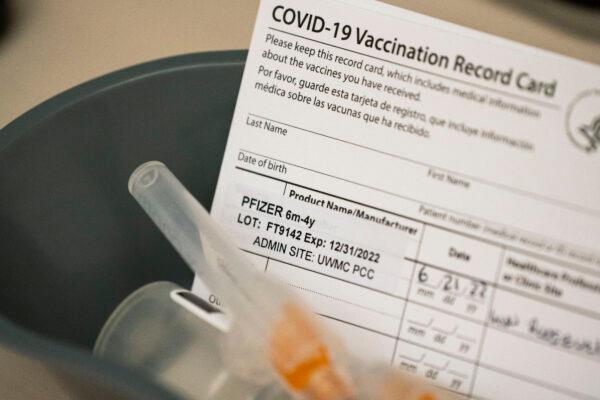 Doses of the Pfizer COVID-19 vaccine and vaccination record cards for children under 5 at UW Medical Center - Roosevelt in Seattle, on June 21, 2022. (David Ryder/Getty Images)