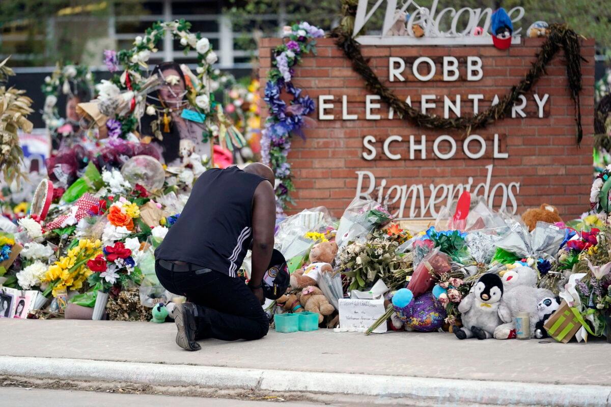 Reggie Daniels pays his respects at a memorial for the shooting victims at Robb Elementary School in Uvalde, Texas, on June 9, 2022. (Eric Gay/AP Photo)