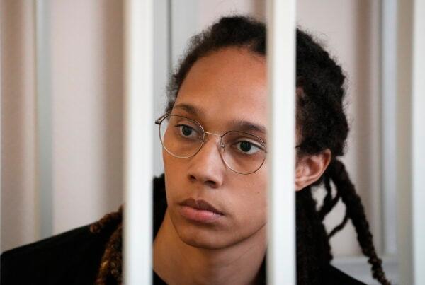 WNBA star and two-time Olympic gold medalist Brittney Griner sits in a cage at a court room prior to a hearing, in Khimki just outside Moscow, Russia, on July 27, 2022. (Alexander Zemlianichenko/Pool/AP)