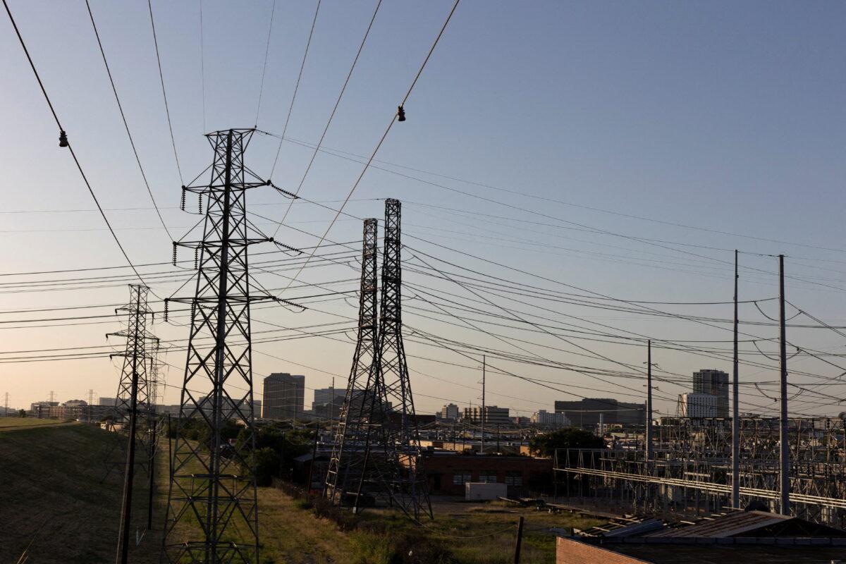 Power lines are seen during a heatwave with expected temperatures of 102 F (39 C) in Dallas on June 12, 2022. Though the heat wave caused electricity use in Texas to reach an all-time high, the power grid remained largely stable without major issues. (Shelby Tauber/Reuters)