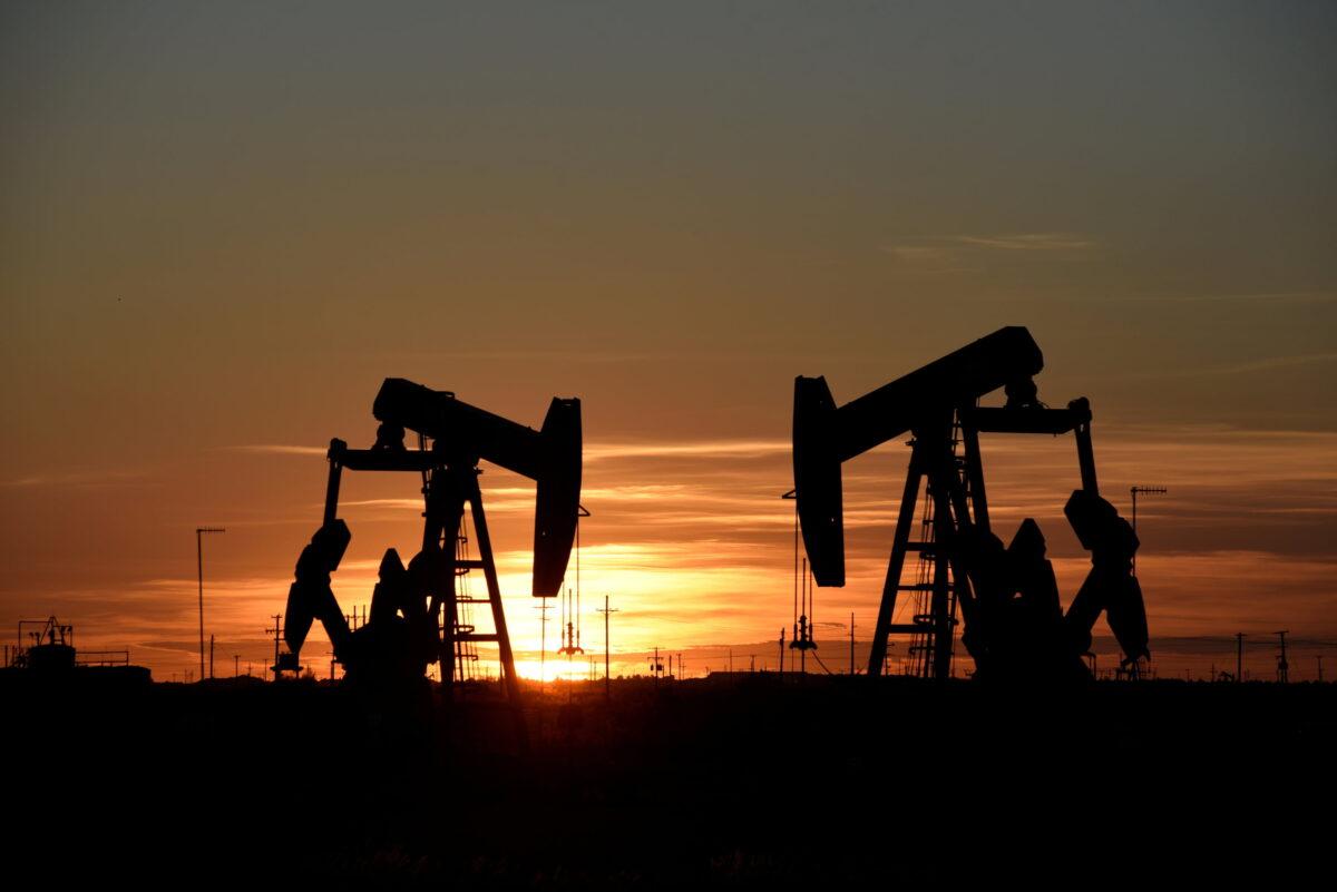 Pump jacks operate at sunset in an oil field in Midland, Texas, on Aug. 22, 2018. (Nick Oxford/Reuters)