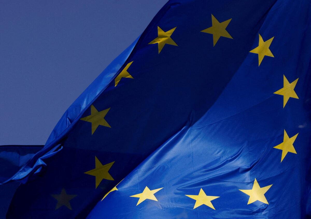 European Union flags flutter outside the EU Commission headquarters in Brussels on June 17, 2022. (Yves Herman/Reuters)