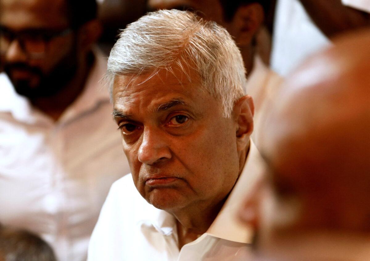 Ranil Wickremesinghe, the then-newly appointed prime minister of Sri Lanka, arrives at a Buddhist temple after his swearing-in ceremony in Colombo, Sri Lanka, on May 12, 2022. (Dinuka Liyanawatte/Reuters)