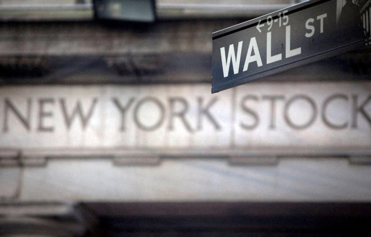 A Wall Street sign is pictured outside the New York Stock Exchange in New York City on Oct. 28, 2013. (Carlo Allegri/Reuters)