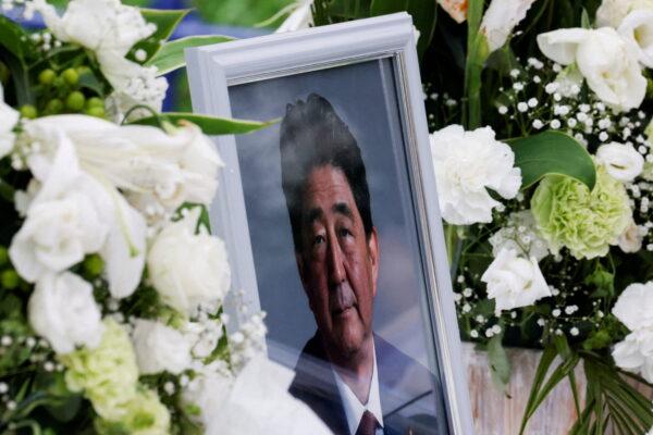 A picture of late former Japanese Prime Minister Shinzo Abe, who was gunned down while campaigning for a parliamentary election, is seen at the Headquarters of the Japanese Liberal Democratic Party in Tokyo, Japan, on July 12, 2022. (Kim Kyung-Hoon/Reuters)