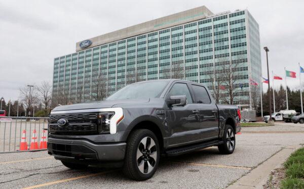 A model of the all-new Ford F-150 Lightning electric pickup is parked in front of the Ford Motor Company World Headquarters in Dearborn, Mich., on April 26, 2022. (Rebecca Cook/Reuters)