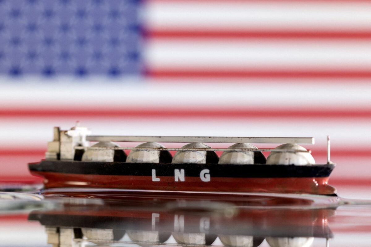 A model of an LNG tanker is seen in front of the U.S. flag in this illustration taken May 19, 2022. (Dado Ruvic/Reuters)