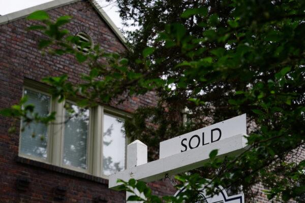A "sold" sign outside of a recently purchased home in Washington on July 7, 2022. (Sarah Silbiger/Reuters)