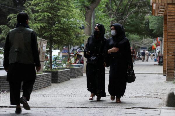 Afghan women walk on a street in Kabul, Afghanistan, on May 9, 2022. (Ali Khara/Reuters)