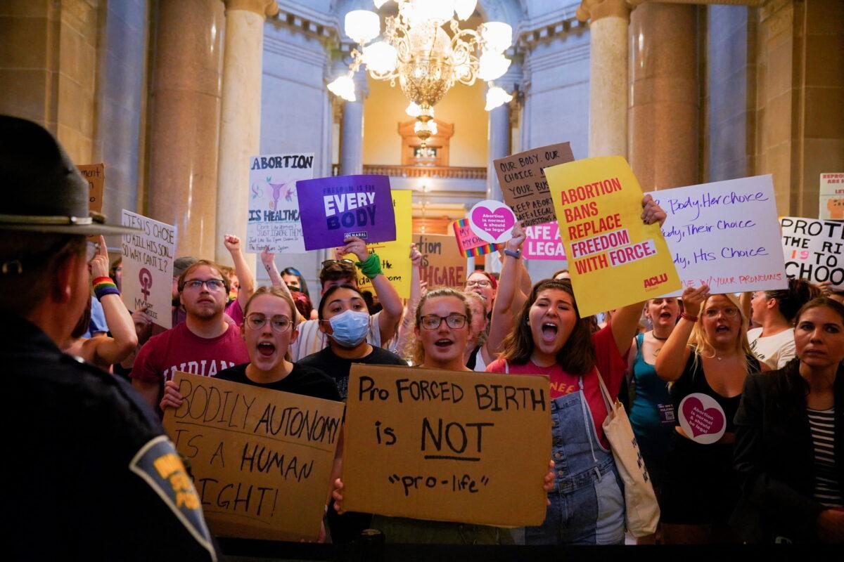 Activists protest outside the senate chambers in the Indiana Statehouse during a special session debating on banning abortion in Indianapolis, on July 25, 2022. (Cheney Orr/Reuters)