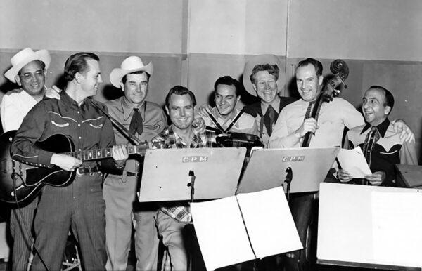 Singers Ray Whitley and Redd Harper, and actor Frank Seeley (far R), with fellow musicians at the Armed Forces Radio Service studio. (Public Domain)