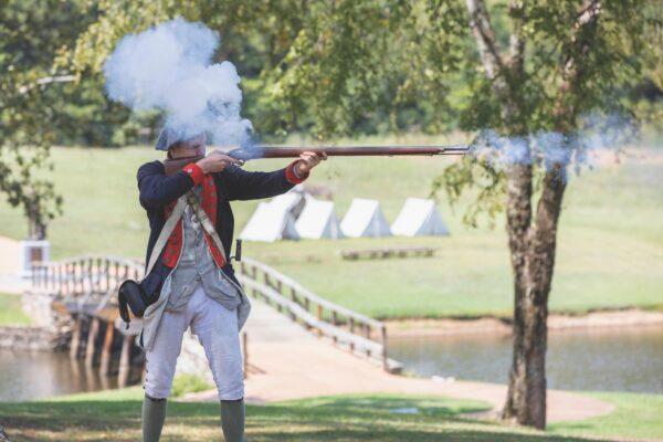 Staff at the American Village keep history alive through period costumes and battle reenactments. (Courtesy of American Village)