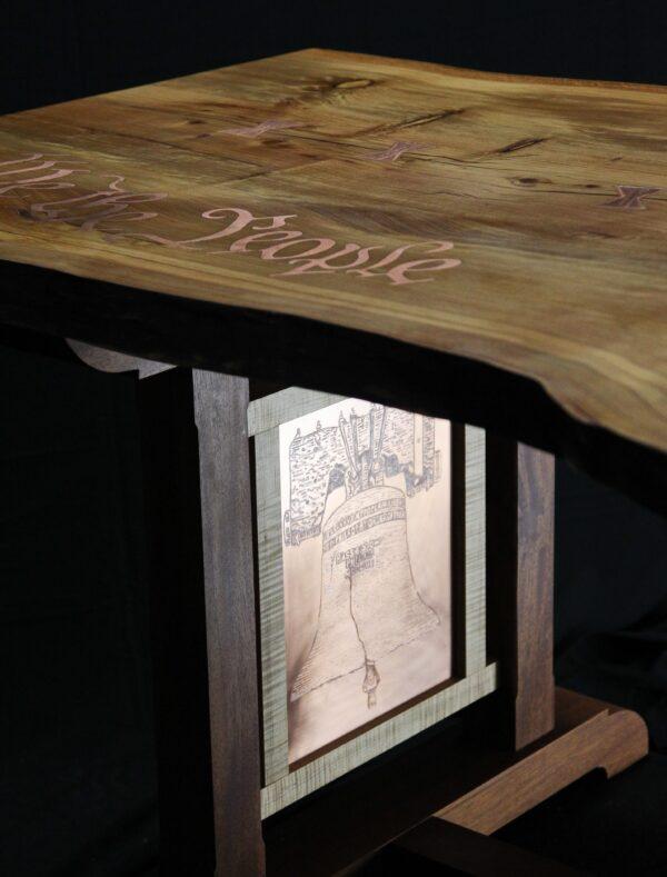 Illustration of the Liberty Bell is etched into the copper panels of the table. (Jason Byers)