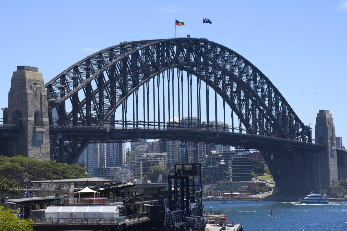 The Australian and Aboriginal flags fly on Sydney Harbour Bridge as part of Australia Day celebrations in Sydney, Australia, on Jan. 26, 2021. (Wendell Teodoro/Getty Images)