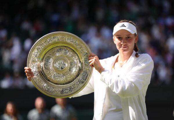 Elena Rybakina of Kazakhstan holds the trophy after victory against Ons Jabeur of Tunisia during the Ladies' Singles Final match on day thirteen of The Championships Wimbledon 2022 at All England Lawn Tennis and Croquet Club in London, England, on July 9, 2022. (Clive Brunskill/Getty Images)