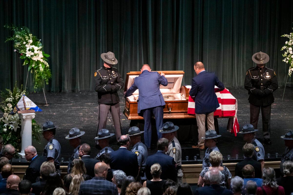 Officers close the casket for Floyd County Deputy William Petry at the Mountain Arts Center in Prestonsburg, Ky., on July 5, 2022. (Silas Walker/Lexington Herald-Leader via AP)