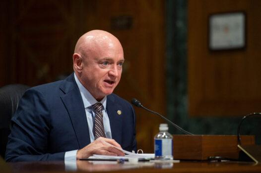 Sen. Mark Kelly (D-Ariz.) speaks during the Senate Finance Committee hearing on the nomination of Chris Magnus to be the next U.S. Customs and Border Protection Commissioner, on Capitol Hill on Oct. 19, 2021. (Rod Lamkey/Pool/AFP via Getty Images)