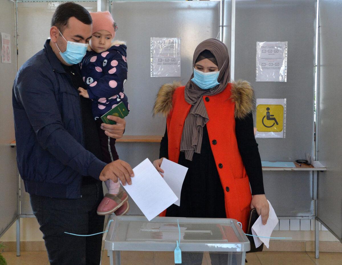 People vote during Uzbekistan's presidential election at a polling station in Tashkent, Uzbekistan, on Oct. 24, 2021. (Vyacheslav Oseledko/ AFP via Getty Images)