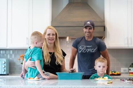  Christine Villaverde, mother and candidate for Congress representing North Carolina, preparing a meal at home with her twin boys, Logan and Gunnar, and her husband, JR. (Courtesy of Christine Villaverde)