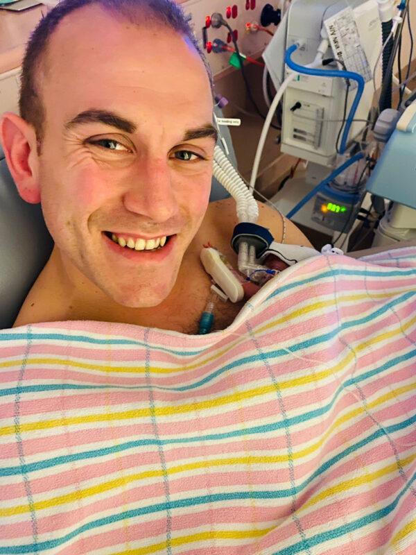 Joel Mackenzie in the NICU at the Women's and Children's Hospital in Adelaide, providing kangaroo care with his preterm daughter Lucy, who weighed 540 grams at birth. (University of South Australia)