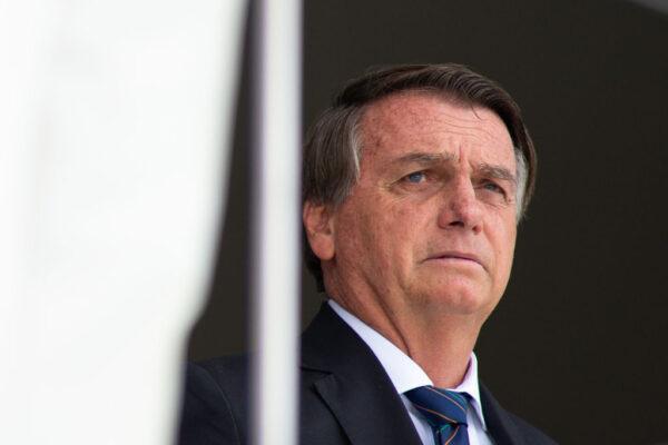 Brazilian President Jair Bolsonaro reacts during the exchange of the presidential guard at Planalto Palace in Brasilia, Brazil, on Dec. 16, 2021. (Andressa Anholete/Getty Images)