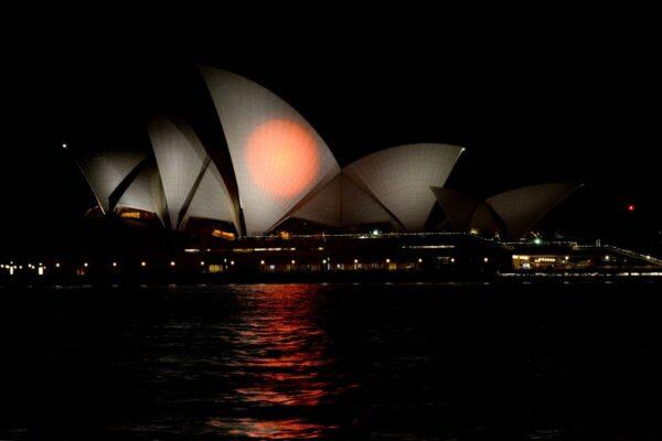 Australia's landmark Opera House in Sydney, Australia, is lit up in the colours of Japan on July 10, 2022, in honour of slain former Japanese Prime Minister Shinzo Abe. (Muhammad Farooq/AFP via Getty Images)