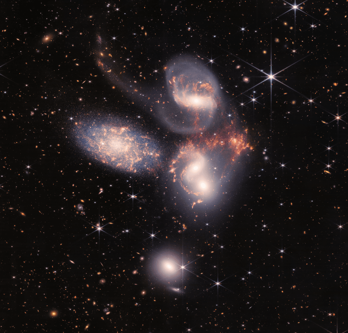 Stephan's Quintet. (<a href="https://webbtelescope.org/contents/media/images/2022/034/01G7DA5ADA2WDSK1JJPQ0PTG4A?Collection=First%20Images&news=true">NASA, ESA, CSA, STScI</a>)